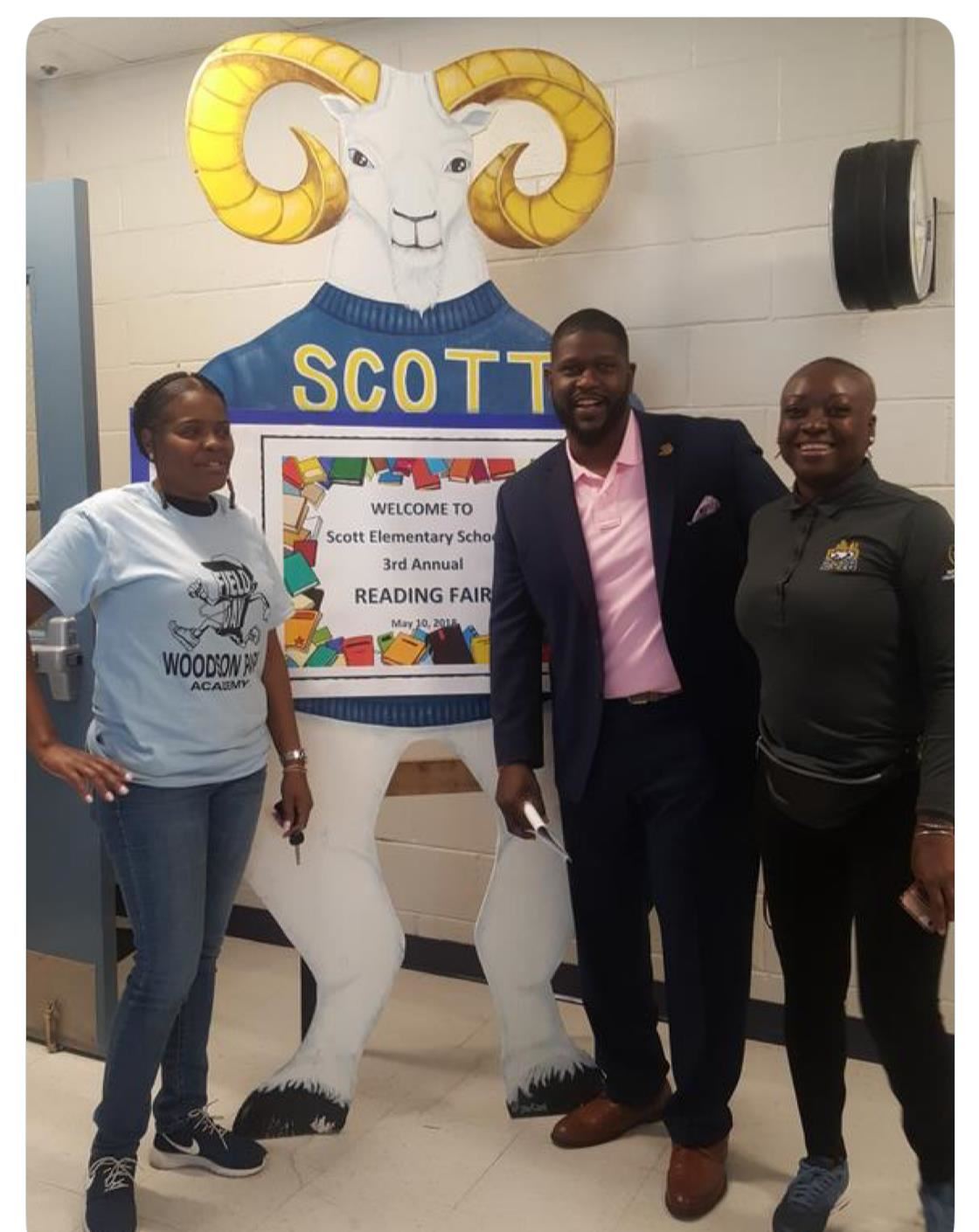 Willam J. Scott Elementary School Principal, Langston Longley pictured with school staff at their third annual reading fair. 