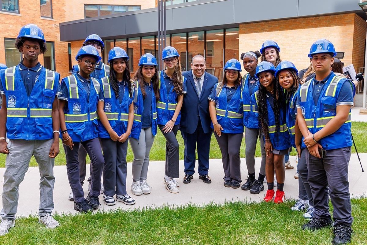 Newark Public Schools Superintendent, Roger Leon with students at an event.