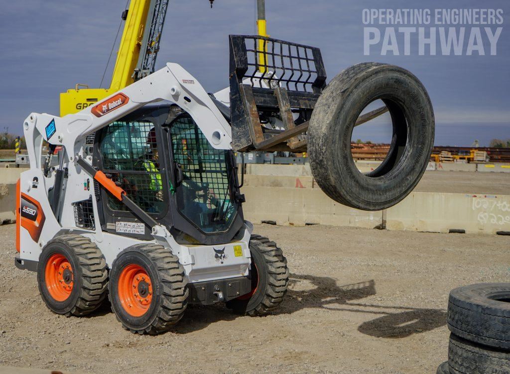 Saint Paul student learing how to operate a construction vehicle